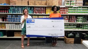 Carolyn Biondi, Executive Director of Arm In Arm, with Sandra Toussaint, President & CEO of United Way of Greater Mercer County. UWGMC is supporting Arm In Arm with a summer 2017 grant of $5,000 to strike out summer hunger.